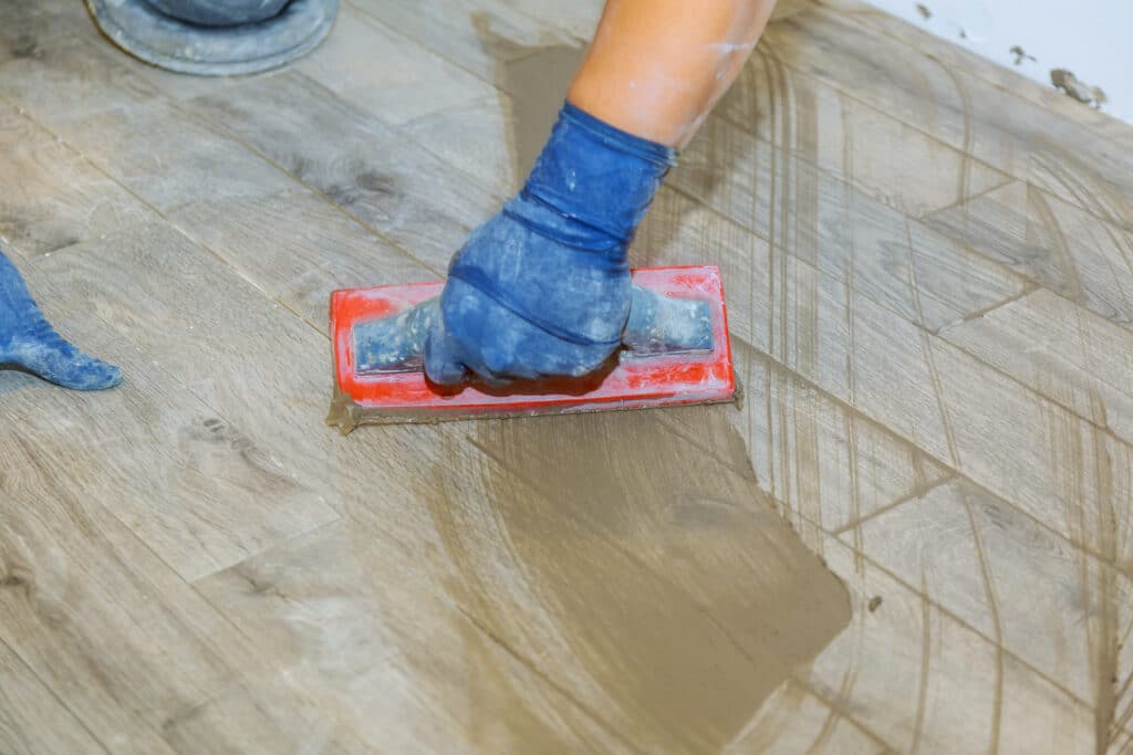 Flooring Pros grouting floor tiles
